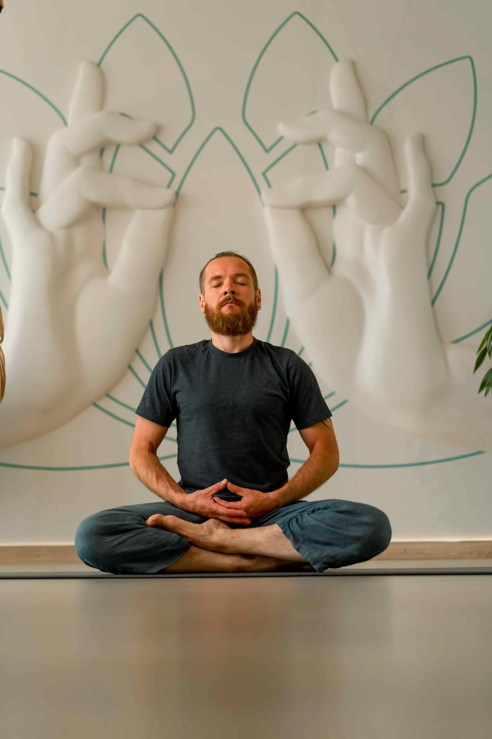 an-adult-man-with-a-beard-holds-his-hands-in-front-2023-12-21-18-11-03-utc man meditating